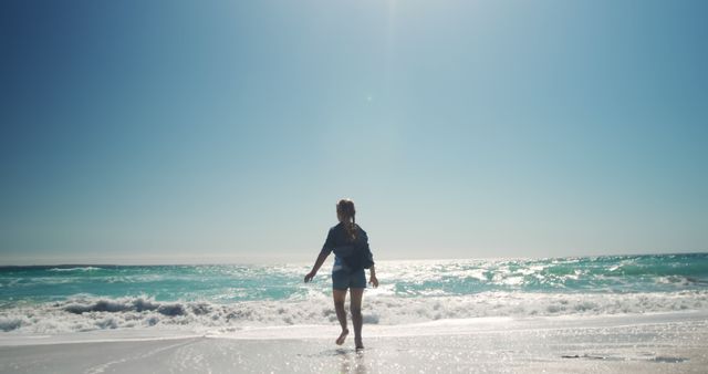 Back View of Woman Walking by Sunny Beach - Download Free Stock Images Pikwizard.com