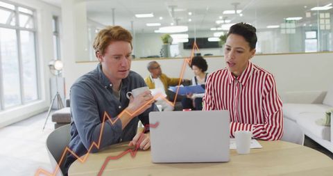 Team Analyzing Growth Data with Digital Graph Overlay in Modern Office