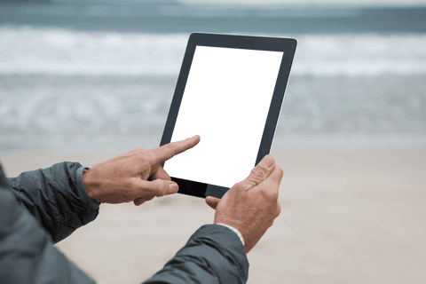 Man Using Transparent Screen Tablet at Beach - Download Free Stock Videos Pikwizard.com