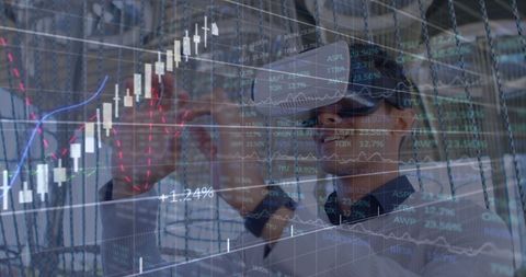 Businessman using vr headset to analyze financial data trends