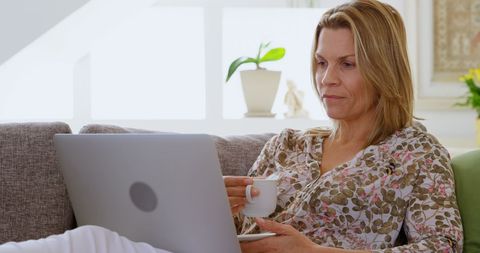 Woman Working Comfortably from Home with Coffee and Laptop - Download Free Stock Images Pikwizard.com