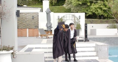 Graduates celebrating success in outdoor setting