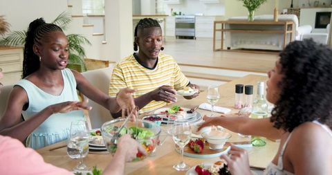 Diverse Friends Enjoy Casual Dinner and Lively Conversation