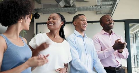 Diverse Team Applauding in Casual Office Environment