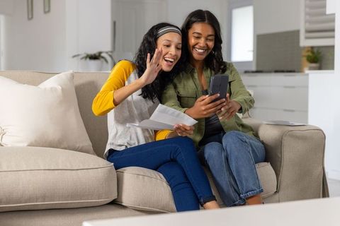 Mother and Daughter Enjoying Video Call at Home