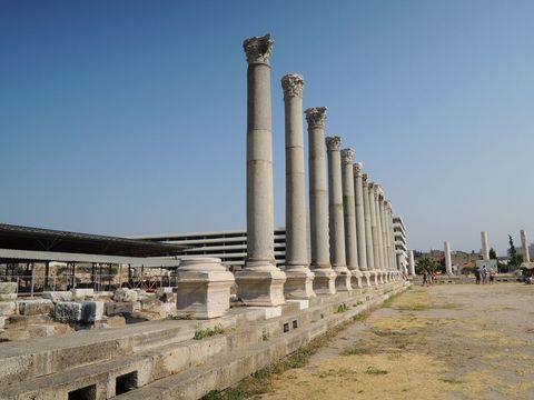 Ancient roman column ruins under clear blue sky