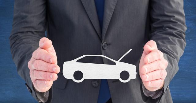 Businessman holding a symbolic car graphic emphasizes the auto industry, illustrating concepts like insurance services, automobile protection, and financial business. This image suits use for promotional materials, insurance advertisements, financial services, automotive brochures, and car dealerships.