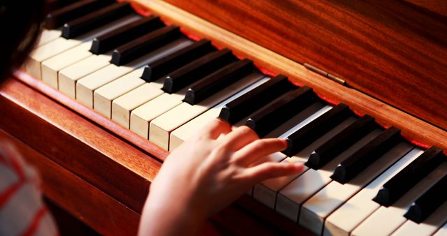 Hand of caucasian schoolgirl playing piano with copy space - Download Free Stock Photos Pikwizard.com