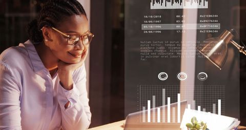 African American Businesswoman Analyzing Data in Office