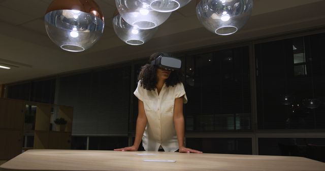 Woman Experiencing Virtual Reality in Modern Office at Night - Download Free Stock Images Pikwizard.com