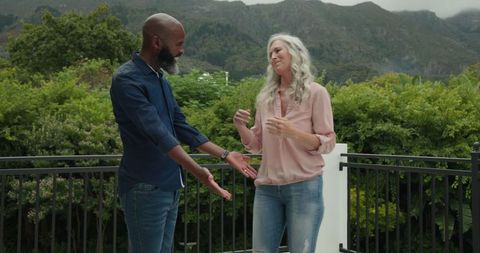 Peaceful couple enjoying moment on scenic balcony