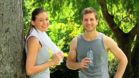Active Couple Relaxing Park Exercise