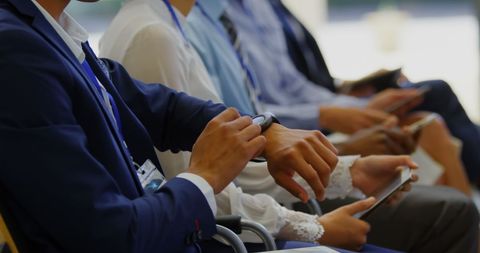 Business Professionals Meeting Checking Mobile Devices