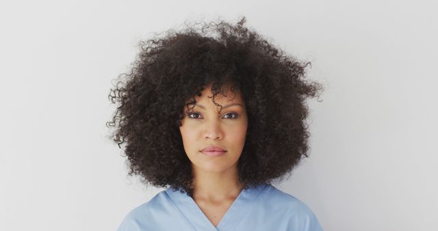 Confident Female Nurse in Blue Scrubs on White Background - Download Free Stock Images Pikwizard.com