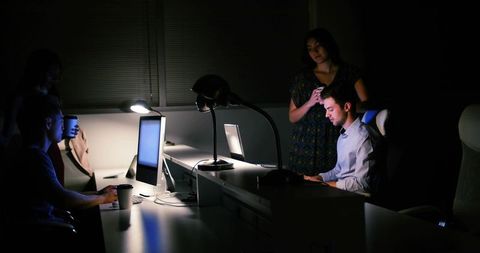 Late-Night Office Collaboration With Focused Teamwork