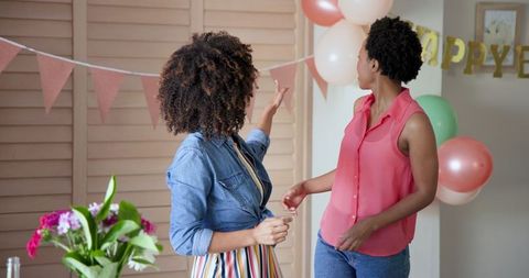 Smiling Friends Decorating for Home Birthday Celebration