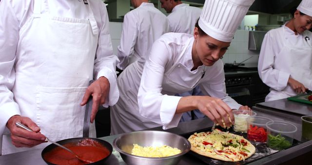 Professional Chefs Preparing Gourmet Pizza in Restaurant Kitchen - Download Free Stock Images Pikwizard.com