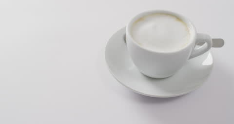 White Latte Cup with Foam on White Background