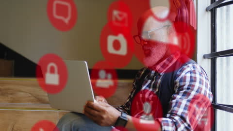 African American Businessman Using Laptop with Digital Content Flow