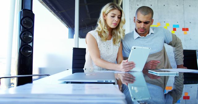 Focused Business Team Analyzing Data on Digital Tablet in Modern Office - Download Free Stock Images Pikwizard.com