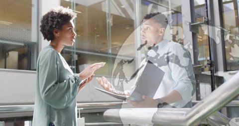 Business Professionals Discussing in Modern Office Atrium