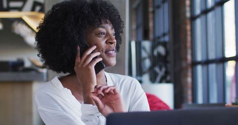 Smiling African American Woman Talking on Smartphone in Cafe - Download Free Stock Images Pikwizard.com