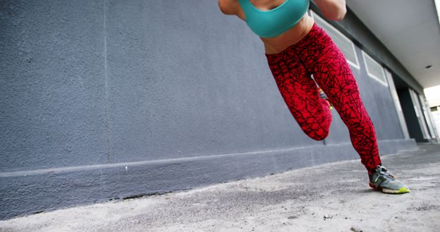 Female Athlete Running by Urban Building Wall in Bright Sportswear - Download Free Stock Images Pikwizard.com