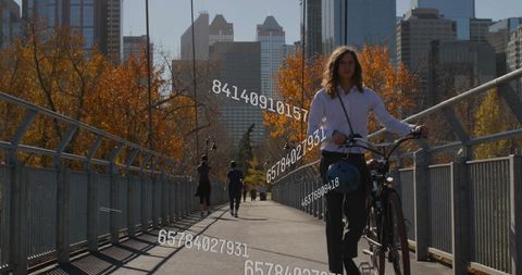 Digital data processing with cyclist in urban autumn setting