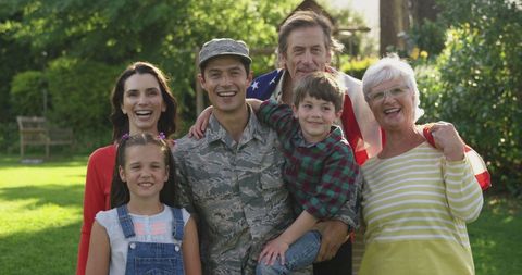 Family Reunion with Returning Soldier in Sunny Garden - Download Free Stock Images Pikwizard.com