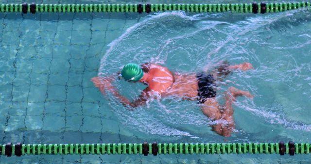 Professional Swimmer in Action Moving Through Lap Pool - Download Free Stock Images Pikwizard.com