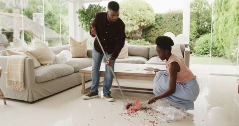 Couple Collaborating on Cleaning Chores at Home