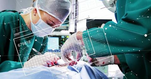 Surgeons Operating with Digital Data Overlay in Modern Medical Environment - Download Free Stock Images Pikwizard.com