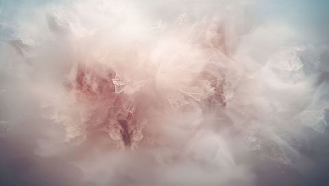 Ethereal rose-beige mist with geometric wireframe mesh forming abstract digital background