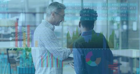 Business professionals analyzing interactive data dashboards on tablet in modern office