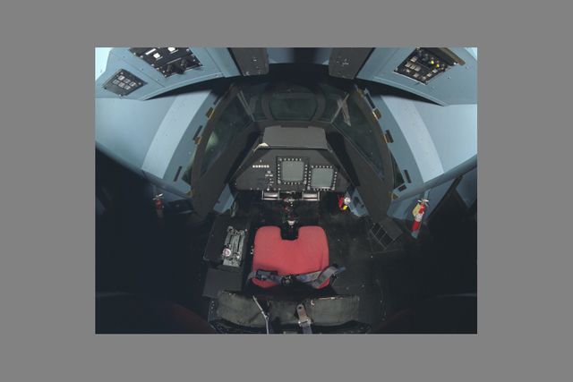 This image presents an overhead view of the NASA Ames Vertical Motion Simulator (VMS) cockpit. Ideal for projects involving aviation training, aerospace engineering, flight simulation technology, or NASA-related studies. Suitable for educational material, technical presentations, and aviation-related articles.