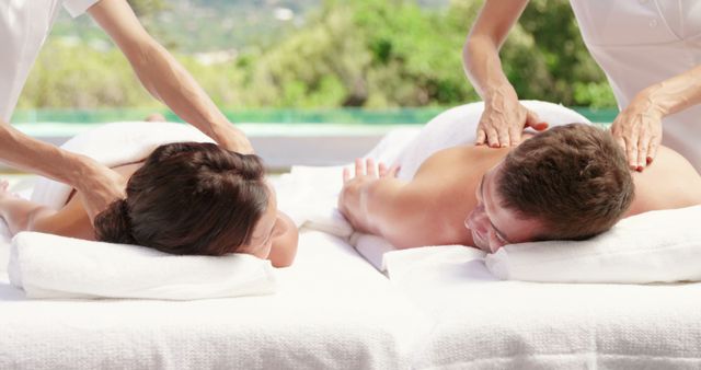 Couple receiving a back massage in slow motion - Download Free Stock Photos Pikwizard.com