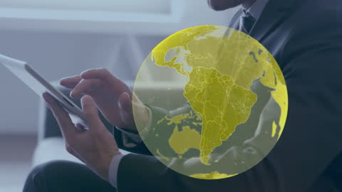 Businessman Engaging with Global Technology on Tablet