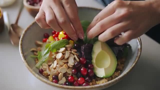 Preparing Fresh Quinoa Salad with Greens and Avocado