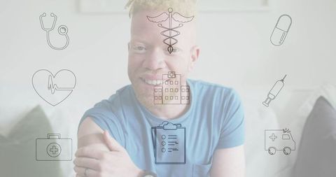 Smiling Man at Home with Medical Icons Illustrating Health and Wellness