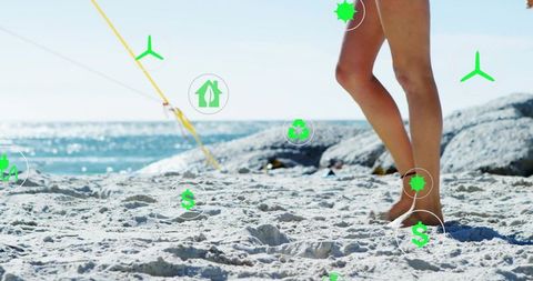 Woman standing on sunny beach barefoot with green eco finance icons overlay
