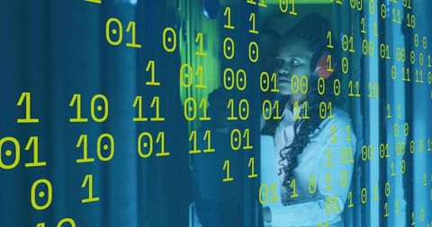 IT Specialist Monitoring Data Center Operations with Digital Overlay