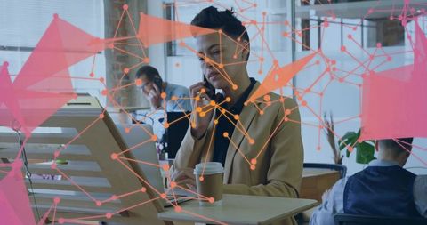 Businesswoman Collaborating in Modern Office with Virtual Network Overlay