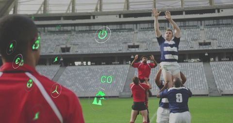 Rugby lineout lift with augmented reality eco and energy icons in modern stadium