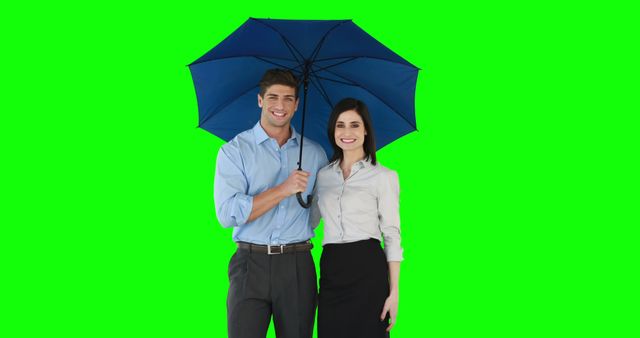 Two cheerful business professionals standing under an umbrella in formal attire with a green screen background. Ideal for corporate presentations, teamwork visuals, advertisements, and weather-related promotional materials requiring a transparent or customizable background.