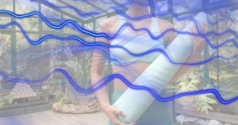 Islander woman holding mint yoga mat in sunroom with tropical plants and blue wave overlay