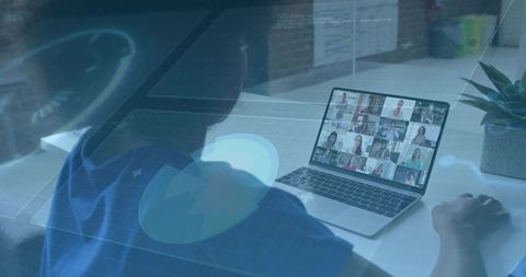 Remote team video conference on laptop with holographic data overlay, hybrid home office collaborati