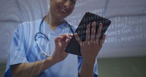 Clinician tapping tablet with ar code overlays representing digital health and secure emr access