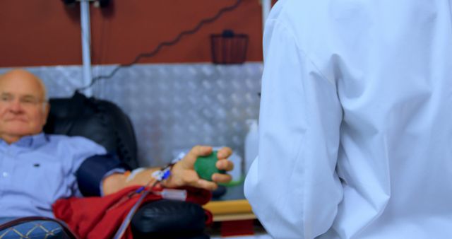 Senior Man Donating Blood with Medical Professional - Download Free Stock Images Pikwizard.com