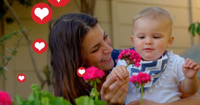 Happy Mother Smiling with Toddler in Garden, Celebrating Parenthood - Download Free Stock Images Pikwizard.com