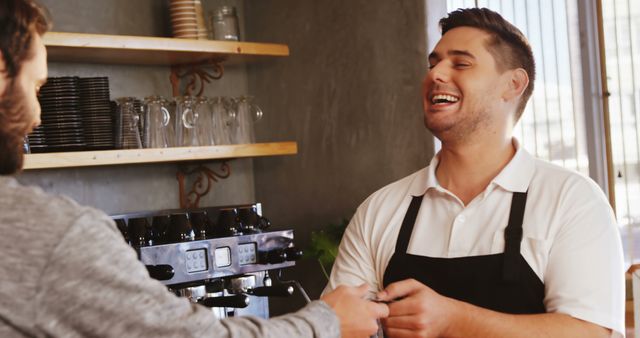 Barista Smiling While Serving a Customer at Coffee Shop Counter - Download Free Stock Images Pikwizard.com